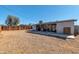 Back of house featuring covered patio, gravel cover, mature trees, and fencing at 3422 W Poinsettia Dr, Phoenix, AZ 85029