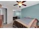 Bedroom featuring a closet, fan, carpet flooring, window and bed at 3422 W Poinsettia Dr, Phoenix, AZ 85029
