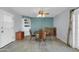 Open dining area with tile flooring, built-in shelving and natural light at 3422 W Poinsettia Dr, Phoenix, AZ 85029