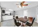 Bright kitchen and dining area featuring tile flooring and modern appliances at 3422 W Poinsettia Dr, Phoenix, AZ 85029