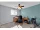Office featuring a ceiling fan, carpet flooring, desk, and chair at 3422 W Poinsettia Dr, Phoenix, AZ 85029