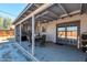 Covered patio with ceiling fan, outdoor dining set and BBQ, perfect for entertaining at 3422 W Poinsettia Dr, Phoenix, AZ 85029