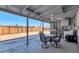 Covered patio with ceiling fan, outdoor dining set and BBQ perfect for entertaining at 3422 W Poinsettia Dr, Phoenix, AZ 85029
