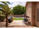 Outdoor oasis with a custom pool, a built-in grill, and a comfortable seating area for entertaining at 345 S Buena Vista Ave, Gilbert, AZ 85296