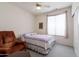 Bedroom featuring a bed, chair, and plenty of natural light at 345 S Buena Vista Ave, Gilbert, AZ 85296