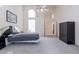 Spacious bedroom with high ceilings and large windows for ample natural light at 345 S Buena Vista Ave, Gilbert, AZ 85296