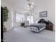 Bright bedroom with vaulted ceilings, natural light and a ceiling fan at 345 S Buena Vista Ave, Gilbert, AZ 85296