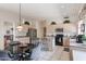 Bright eat-in kitchen features stainless steel appliances, island with seating, and tile flooring at 345 S Buena Vista Ave, Gilbert, AZ 85296