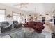 Cozy living room with stylish decor and view into the kitchen at 345 S Buena Vista Ave, Gilbert, AZ 85296