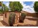 Backyard featuring a wooden storage shed surrounded by low-maintenance landscaping at 345 S Buena Vista Ave, Gilbert, AZ 85296