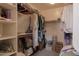 Well-organized walk-in closet featuring shelves and clothing racks for optimal storage solutions at 345 S Buena Vista Ave, Gilbert, AZ 85296