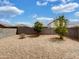 Desert landscaped back yard with rock ground cover and fruit trees at 35337 W San Alvarez Ave, Maricopa, AZ 85138