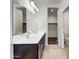 Bathroom featuring double sinks, tile flooring, and modern fixtures at 35337 W San Alvarez Ave, Maricopa, AZ 85138