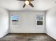 Bright bedroom with natural light, ceiling fan, and carpeted floors at 35337 W San Alvarez Ave, Maricopa, AZ 85138