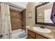 Bathroom with tiled shower-tub combo, vanity, and toilet at 3709 W Grovers Ave, Glendale, AZ 85308