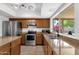 Modern kitchen with stainless steel appliances, including a double sink, for efficient meal preparation and cleanup at 3709 W Grovers Ave, Glendale, AZ 85308