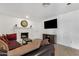 Bright living room featuring a fireplace and entertainment center at 3709 W Grovers Ave, Glendale, AZ 85308
