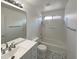 Bright bathroom featuring a shower-tub combo, sleek vanity and stylish patterned floor tiles at 4005 W Carter Rd, Phoenix, AZ 85041