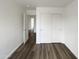 Clean and bright bedroom with neutral walls, wood floors, and a large closet at 4005 W Carter Rd, Phoenix, AZ 85041