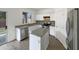 Modern kitchen with granite countertops, stainless steel appliances, and a center island at 4005 W Carter Rd, Phoenix, AZ 85041