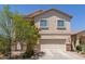 Charming two-story home featuring a well-maintained front yard and attached two-car garage at 44810 W Horse Mesa Rd, Maricopa, AZ 85139