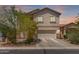 Charming two-story home features a neutral color palette, complemented by well-maintained landscaping at 44810 W Horse Mesa Rd, Maricopa, AZ 85139