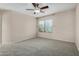 Bright bedroom with a large window offering natural light and comfortable carpet flooring at 4653 W Dublin St, Chandler, AZ 85226