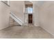 Bright entryway featuring a high ceiling, tile flooring, and staircase at 4653 W Dublin St, Chandler, AZ 85226