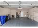 This large garage is well-equipped with storage shelves, a utility sink, and an efficient water heater at 4653 W Dublin St, Chandler, AZ 85226