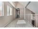 Bright upstairs hallway with neutral walls, carpet floors, and natural light from a window with white blinds at 4653 W Dublin St, Chandler, AZ 85226