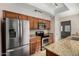 Modern kitchen with stainless steel appliances and granite countertops at 4653 W Dublin St, Chandler, AZ 85226