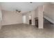 Open-concept living room with tile flooring, a fireplace and ceiling fan at 4653 W Dublin St, Chandler, AZ 85226