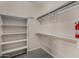 Walk-in closet with shelving and hanging rods, providing ample storage space at 4653 W Dublin St, Chandler, AZ 85226