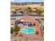 Aerial view of a home with a backyard pool, pergola, and well-maintained landscaping at 4728 N 92Nd Ave, Phoenix, AZ 85037
