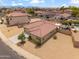 Aerial view of a single-story home with terracotta roof, a well-maintained yard and desert landscaping at 4728 N 92Nd Ave, Phoenix, AZ 85037