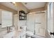 Full bathroom with updated vanity, shower with glass doors, and neutral color scheme at 4728 N 92Nd Ave, Phoenix, AZ 85037