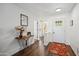View of the front foyer featuring wood look floors, neutral paint, and decor at 4728 N 92Nd Ave, Phoenix, AZ 85037