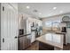 Bright kitchen showcasing stainless steel refrigerator, plentiful counter space, and modern appliances at 4728 N 92Nd Ave, Phoenix, AZ 85037