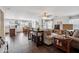 Open-concept living room with wood-look flooring, neutral walls, and ample natural light at 4728 N 92Nd Ave, Phoenix, AZ 85037