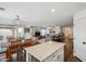 Open-concept living space with seamless flow to dining and kitchen, and access to outdoor area at 4728 N 92Nd Ave, Phoenix, AZ 85037