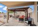 Covered patio with outdoor seating, a hot tub, and privacy walls at 4728 N 92Nd Ave, Phoenix, AZ 85037