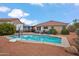 Sparkling pool with basketball hoop surrounded by patio area with pergola at 4728 N 92Nd Ave, Phoenix, AZ 85037