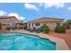 Inviting pool and patio area, with lounge chairs, and a pergola with outdoor seating at 4728 N 92Nd Ave, Phoenix, AZ 85037