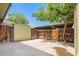 Spacious backyard patio with wood fence and mature shade trees, great for entertaining outdoors at 4743 N 26Th Ln, Phoenix, AZ 85017