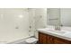 Well-maintained bathroom with a shower-tub combo and sleek wood vanity with a sink at 4743 N 26Th Ln, Phoenix, AZ 85017