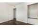 Bedroom with a small closet and door, complemented by sleek hardwood floors at 4743 N 26Th Ln, Phoenix, AZ 85017