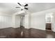 Well-lit bedroom featuring hardwood floors, a ceiling fan, and closet with sliding doors at 4743 N 26Th Ln, Phoenix, AZ 85017