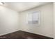Cozy bedroom with a window that offers plenty of natural light and hardwood floors at 4743 N 26Th Ln, Phoenix, AZ 85017