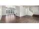 Spacious living area featuring modern flooring and easy access to the home's upper level at 4743 N 26Th Ln, Phoenix, AZ 85017