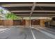 Assigned covered parking for residents with adjacent private storage area and visitor parking nearby at 4743 N 26Th Ln, Phoenix, AZ 85017